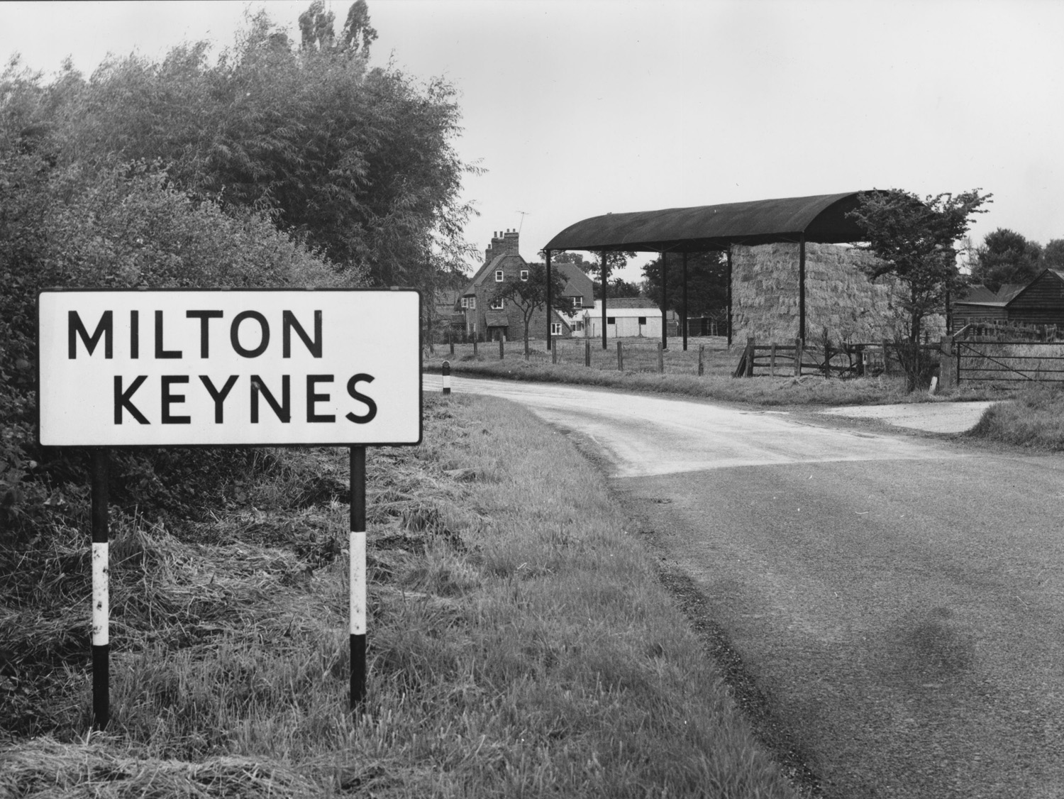 old black and white image of milton keynes road sign